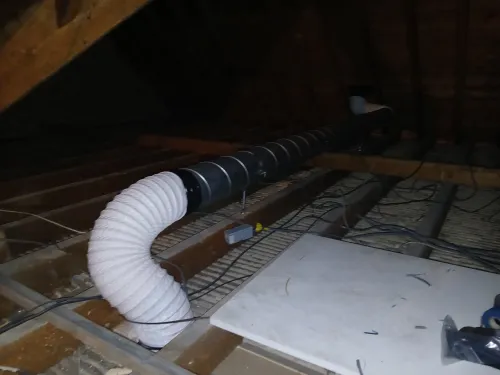 Attic ducting with fan outlet
