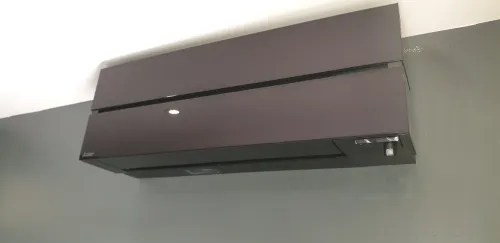 Black Mitsubishi Electric air conditioning unit close-up