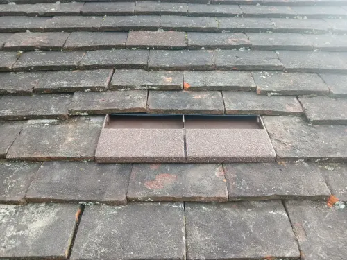 Tile roof outlet with hidden vent