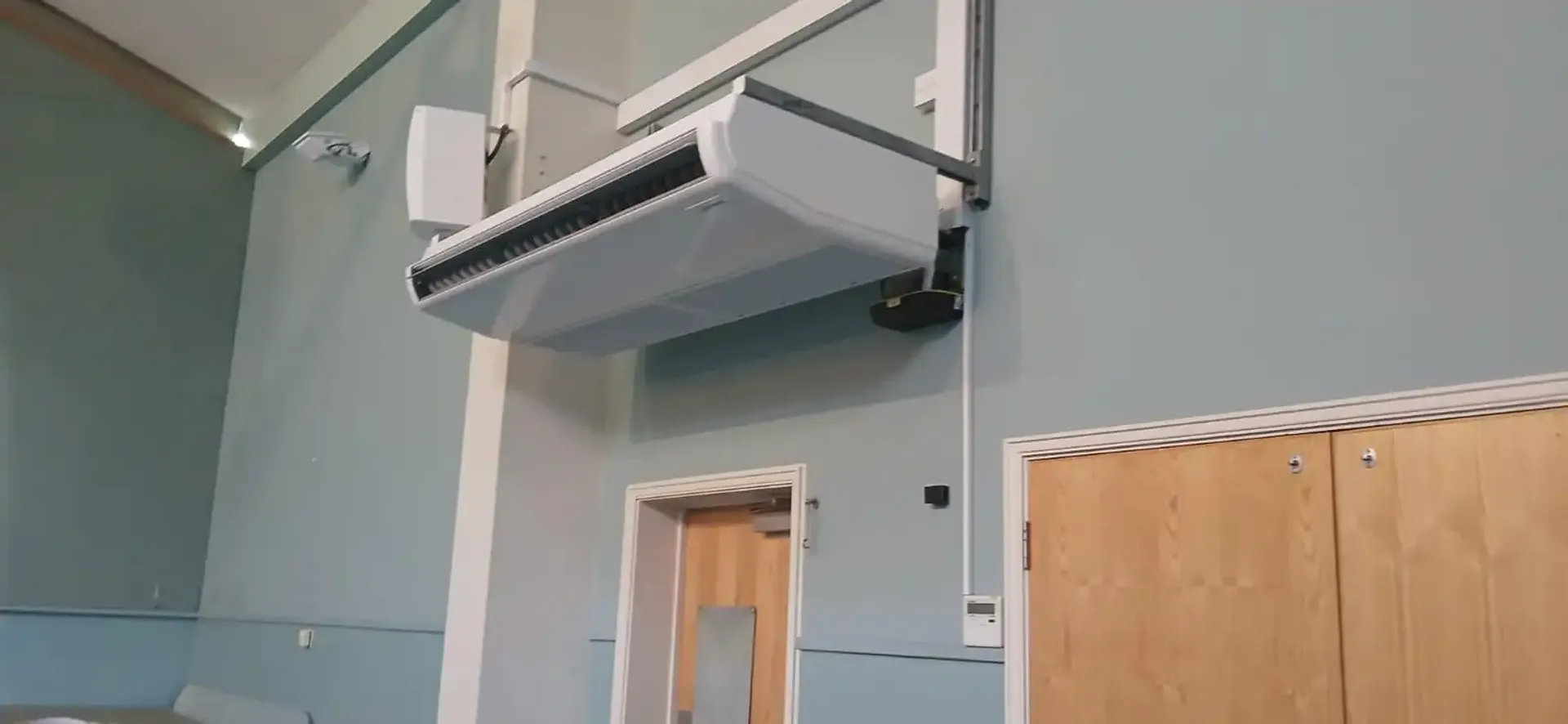 Wall-mounted Mitsubishi Electric air conditioning unit in a Sussex home