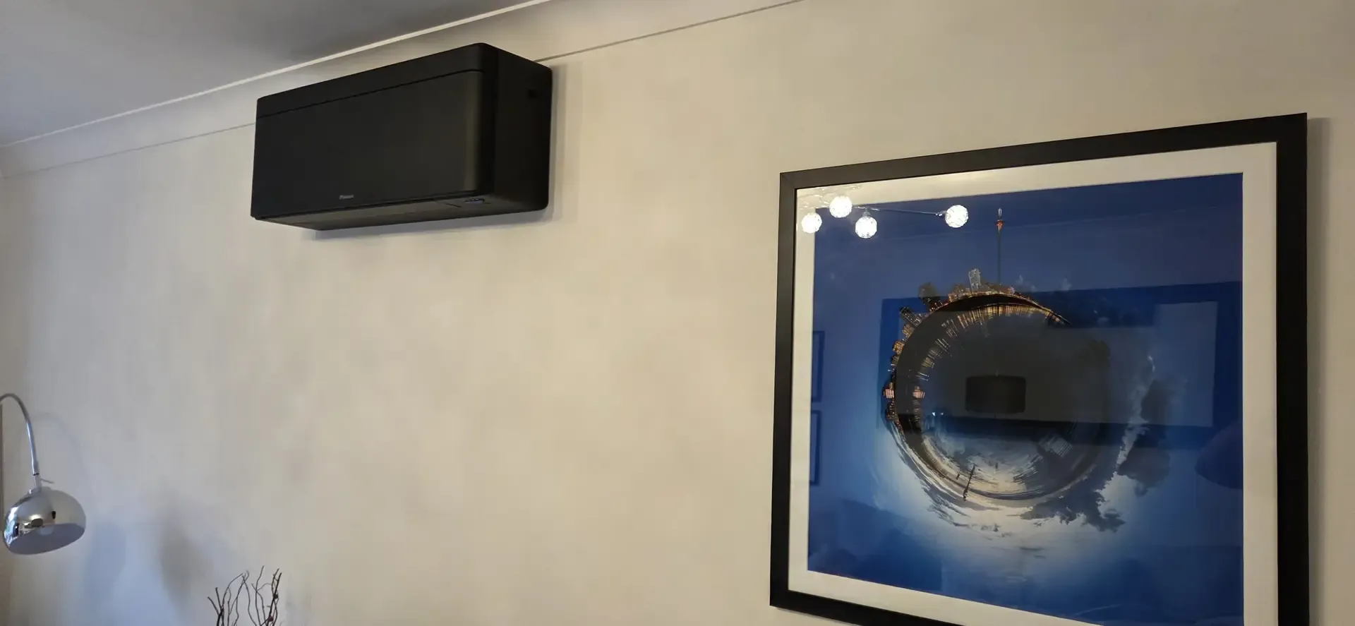 Daikin Emura wall-mounted air conditioning unit in a living room