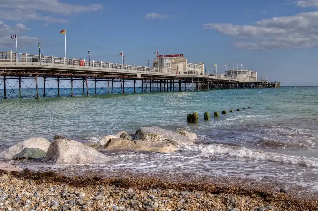 Air conditioning installation services in Worthing with scenic view of the seafront and pier