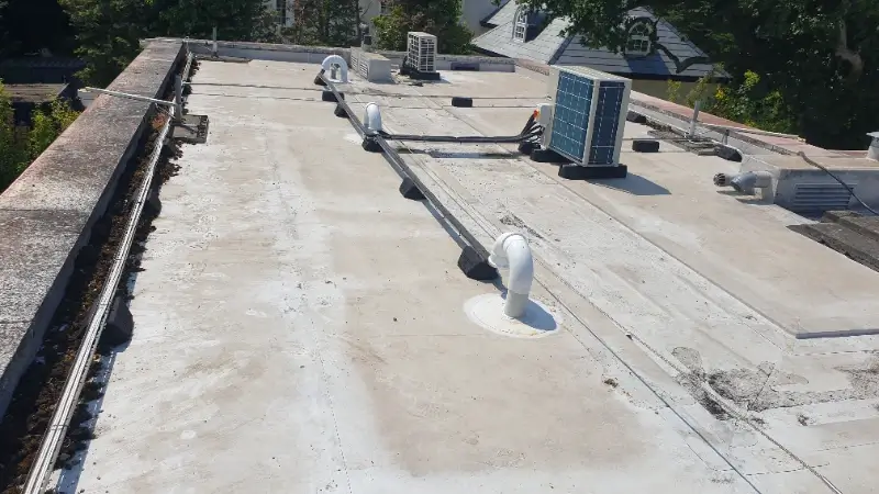 Outdoor condenser and weather-sealed cable tray on Coombe Estate roof