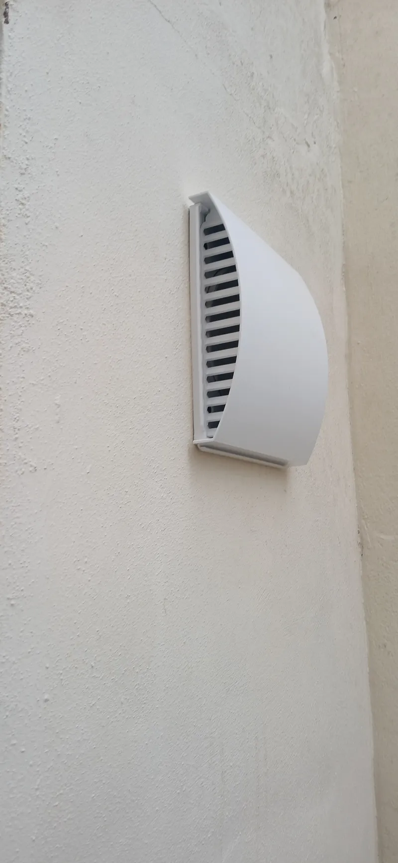 External cowl and grille for dMVHR ventilation on Brighton basement flat