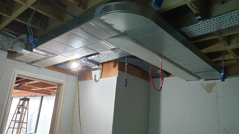 MVHR main inlet galvanized steel ducting installation in Pulborough eco home ceiling void