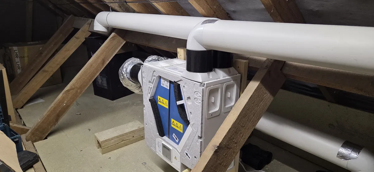 Vent-Axia MVHR unit installed in a loft with rigid ducting — a typical residential installation in Small Dole, Sussex