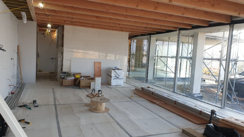 Reverse view of open-plan kitchen with integrated MVHR ventilation system