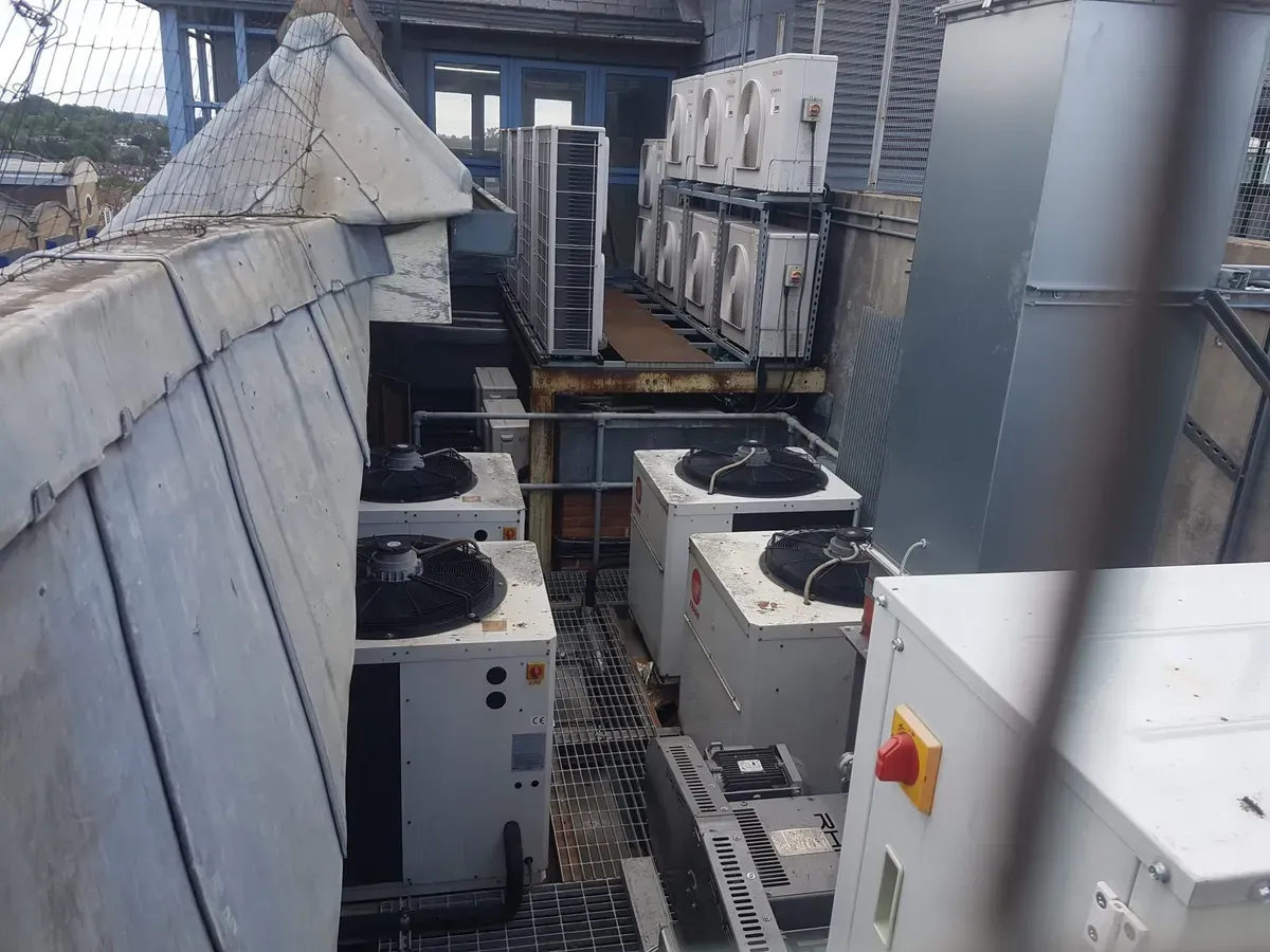Technician performing maintenance on an HVAC system